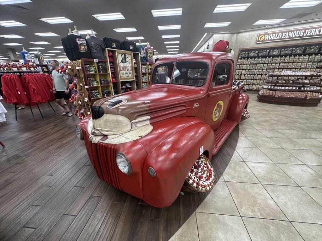 Red vintage truck display inside Buc-ee's in Denton, Texas
