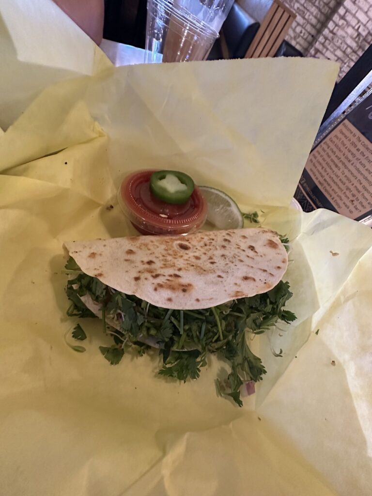 Plant based taco from Enoki Eatz with cilantro, lime, salsa, and jalapeno.