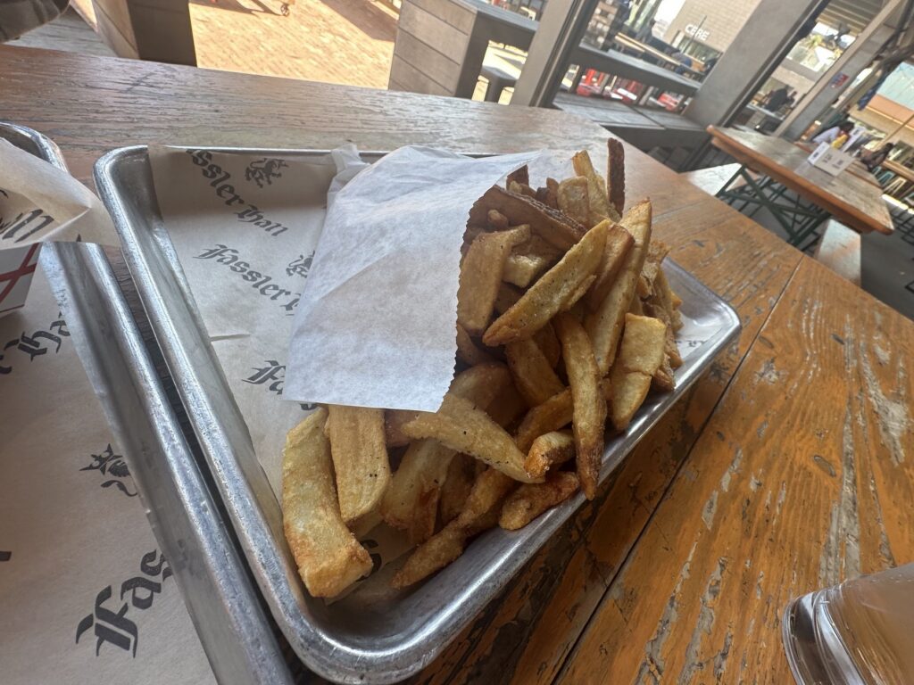 Duck fat fries served on a tray at Fassler Hall OKC.
