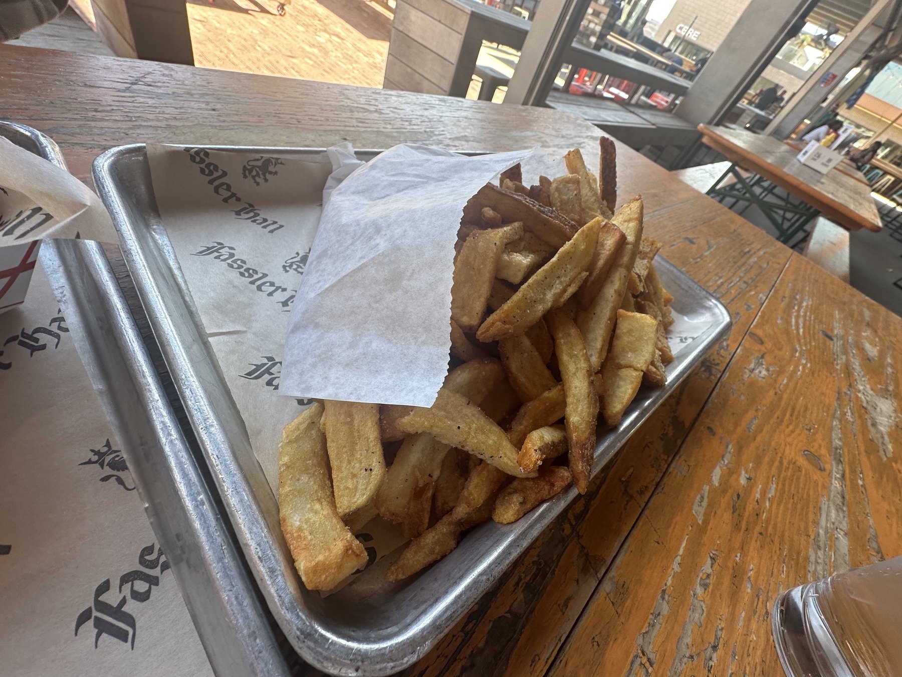Duck fat fries served on a tray at Fassler Hall OKC.