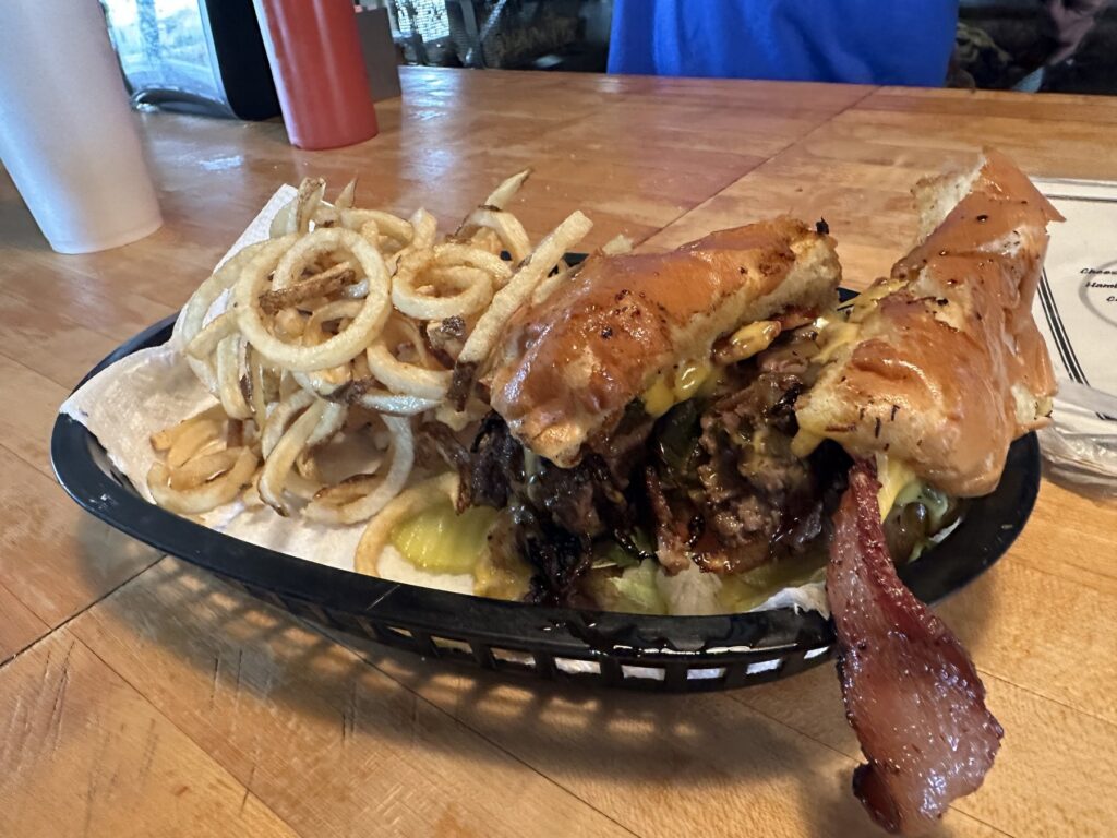 Close-up of a bacon cheeseburger basket with fries at Nic's Grill in Oklahoma City