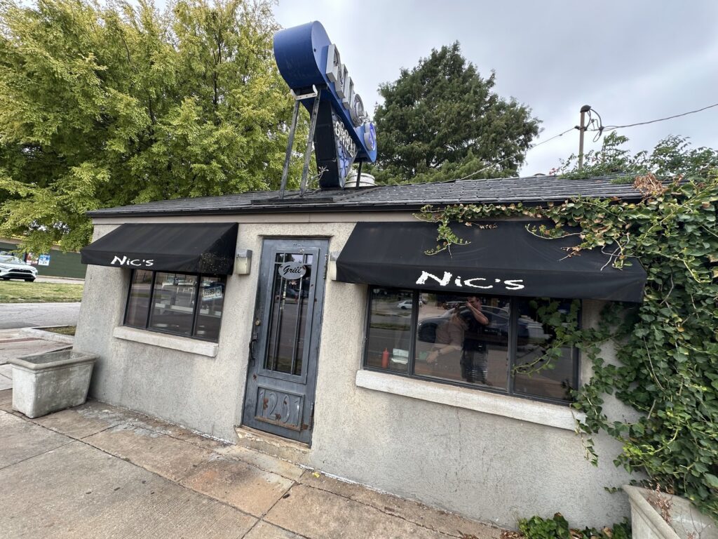Front entrance and black awnings at Nic's Grill in Oklahoma City