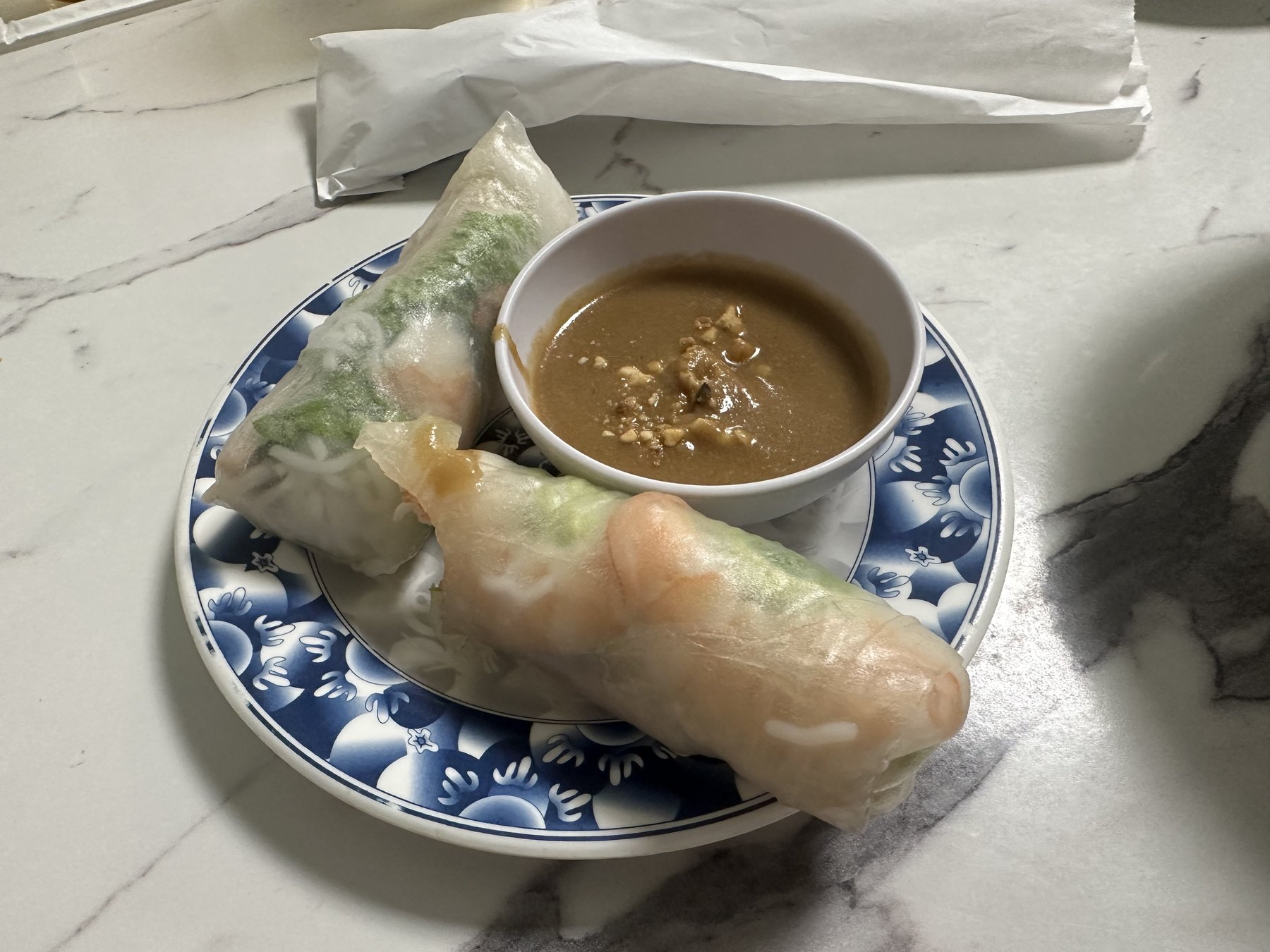 Fresh Vietnamese spring rolls served with peanut dipping sauce at Pho Cuong.