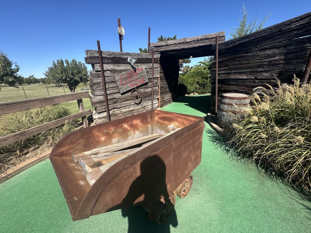 Gold mine-themed miniature golf obstacle with an ore cart at JR’s Pub and Grill in Oklahoma City.