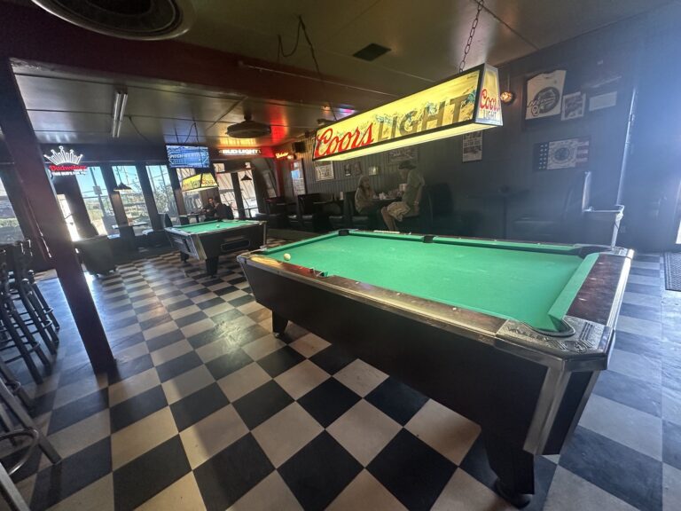 Pool tables and neon beer signs inside JR’s Pub and Grill in Oklahoma City.