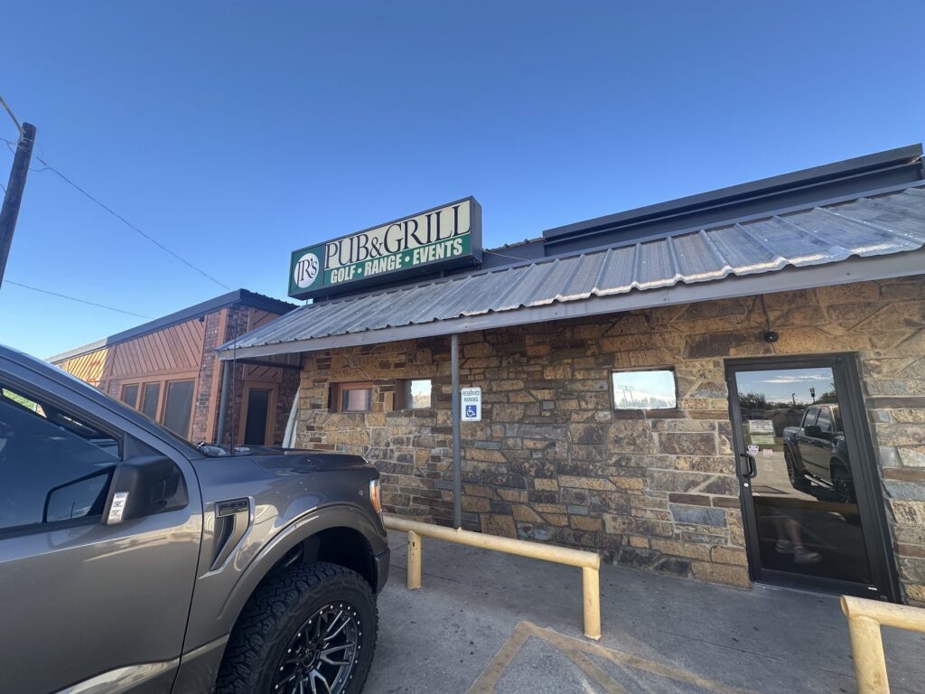 Exterior sign for JR’s Pub and Grill, Golf, Range and Events in Oklahoma City.