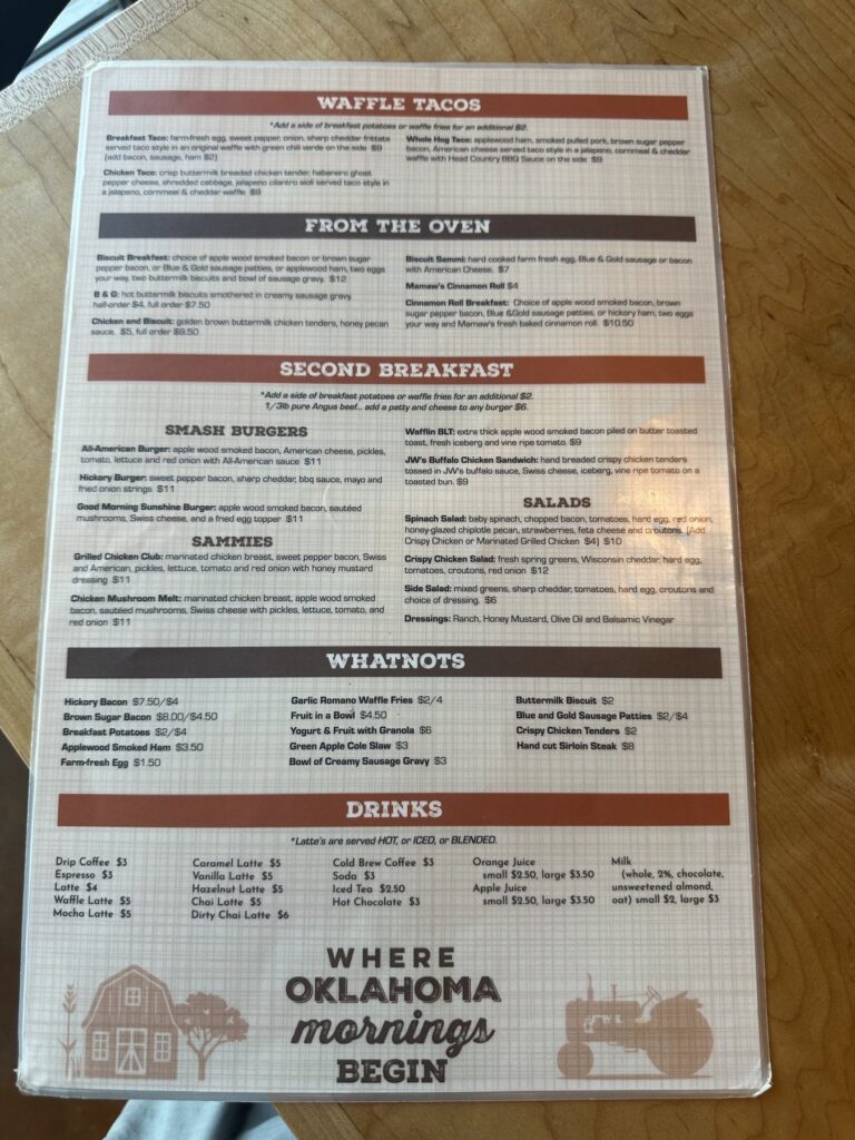 Just Wafflin’ menu page showing waffle tacos, burgers, sandwiches, sides, and drinks