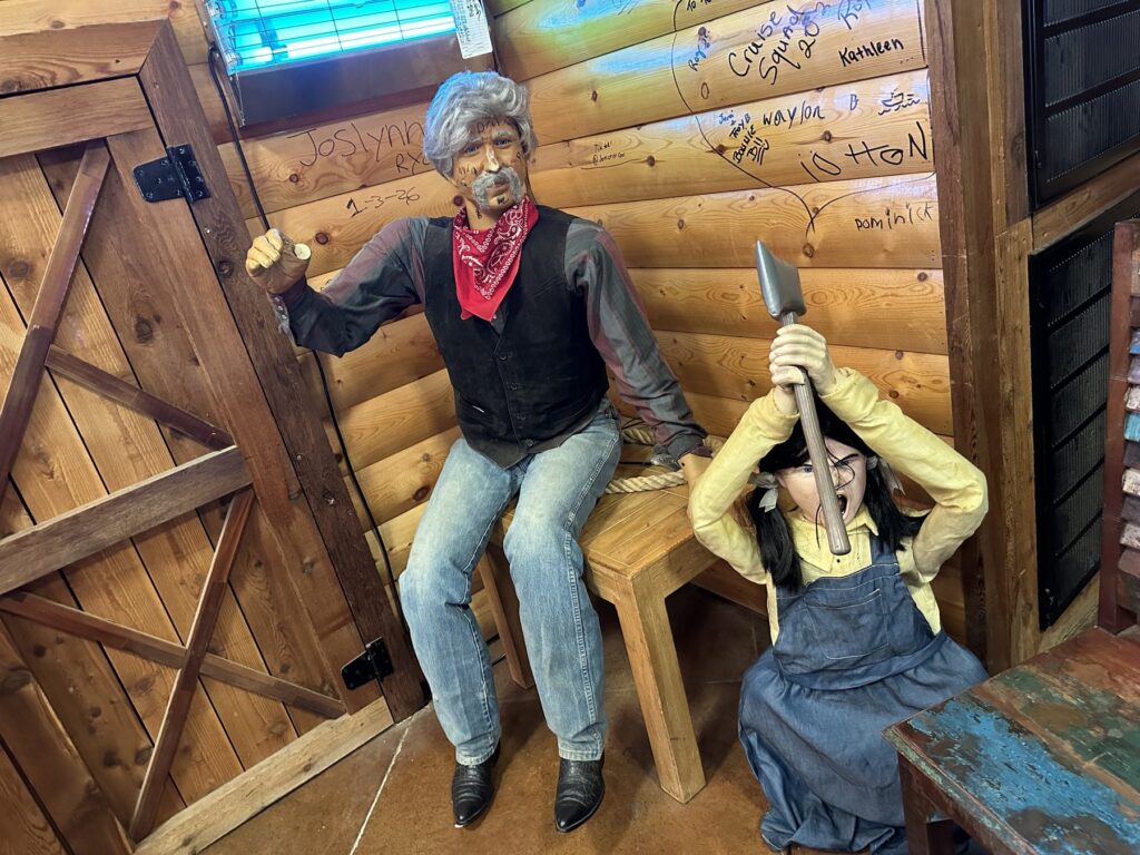 Western-themed mannequins displayed inside Cowboy Travel Plaza in Oklahoma