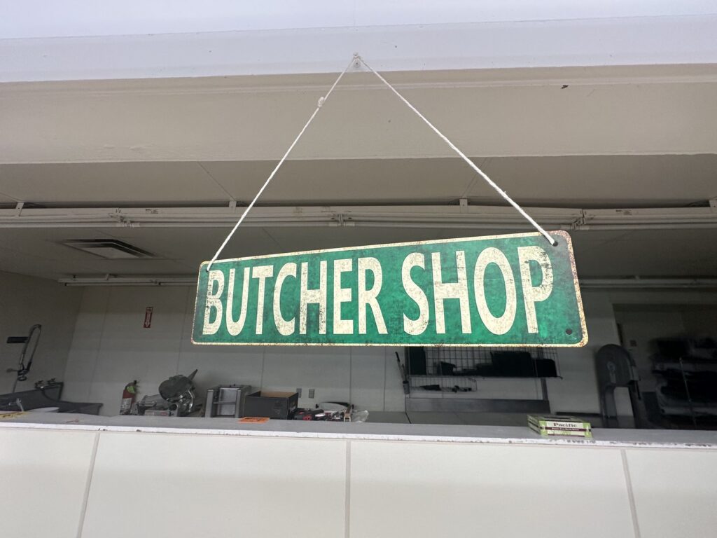 Butcher Shop sign hanging above the meat counter inside Sweis Foods in Oklahoma City