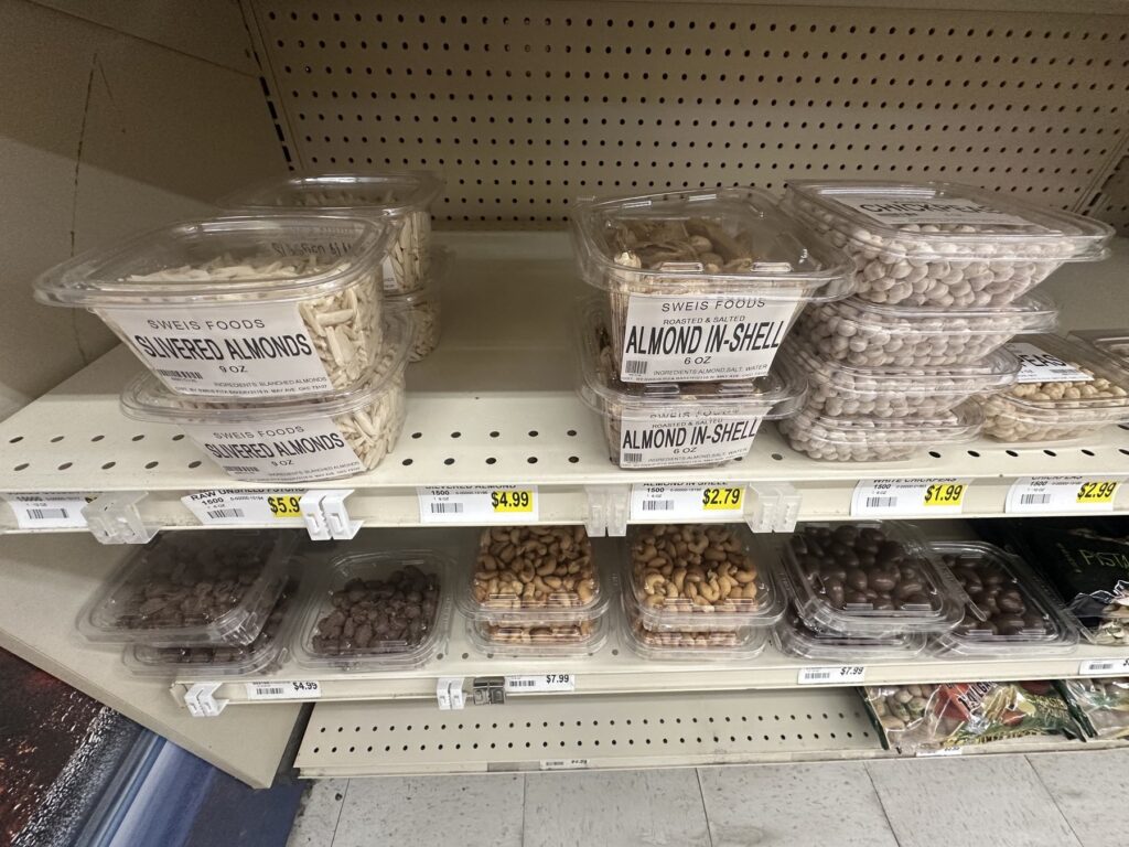 Sweis Foods packaged nuts including slivered almonds and in-shell almonds on grocery shelves