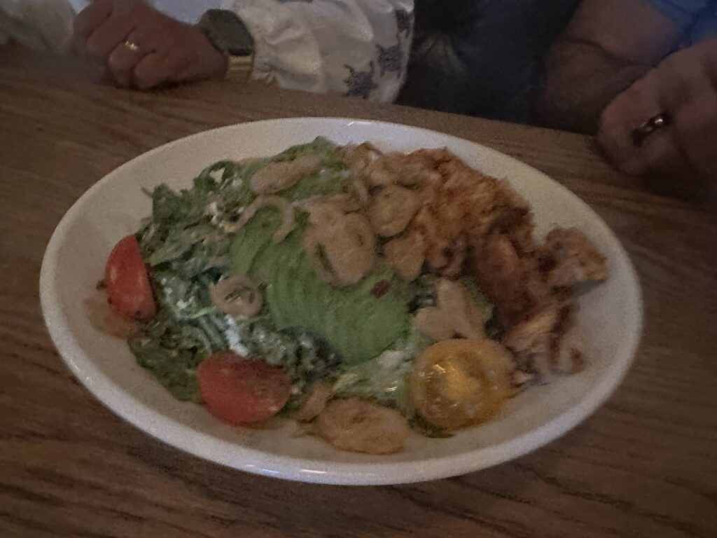 Green salad with avocado and tomatoes at Red Rooster in Oklahoma City.