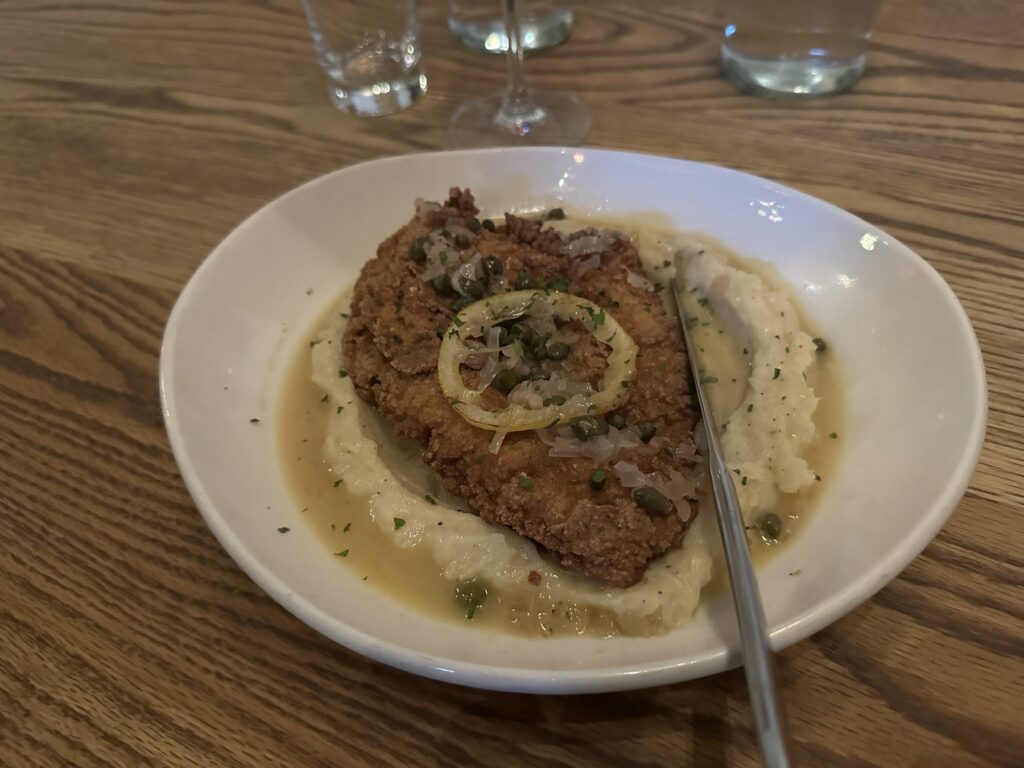 Chicken piccata served over mashed potatoes with lemon and capers at Red Rooster in Oklahoma City.
