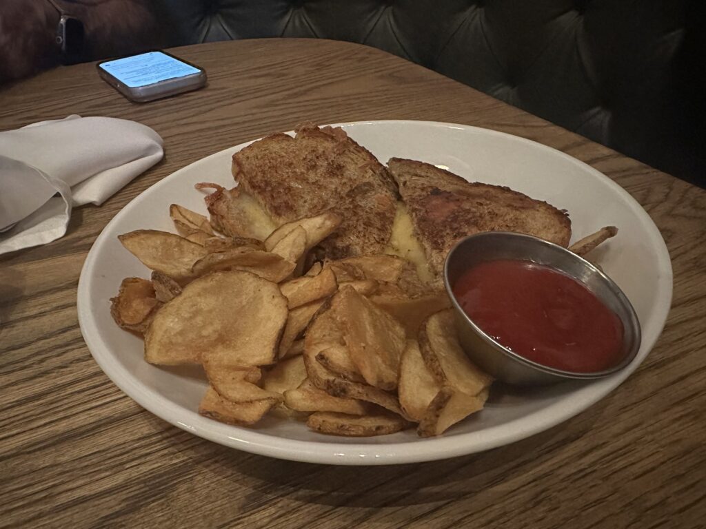 Toasted sandwich with house chips and red dipping sauce at Red Rooster in Oklahoma City.