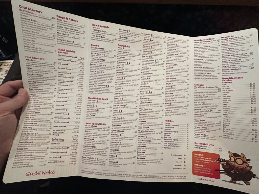 Open Sushi Neko menu showing sushi rolls, starters, entrees, desserts, and drinks.